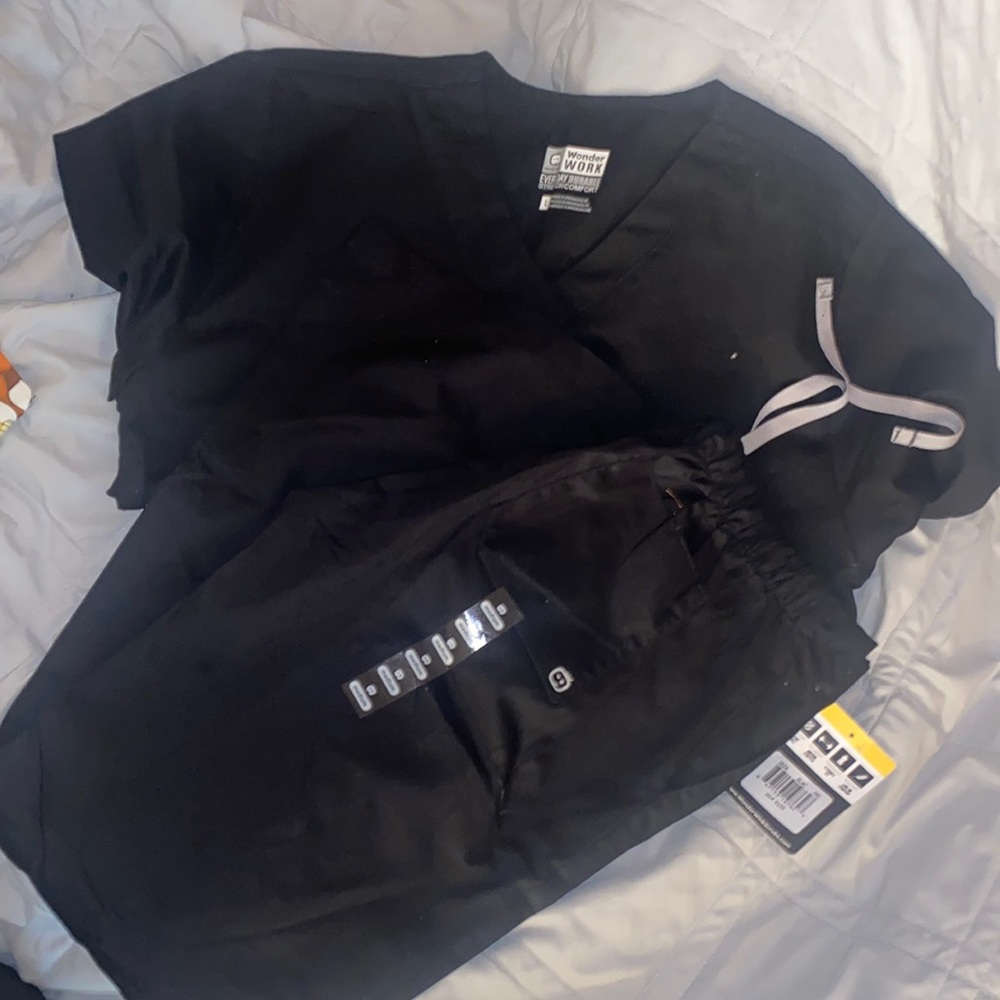 size med wonderwink pants and size large top